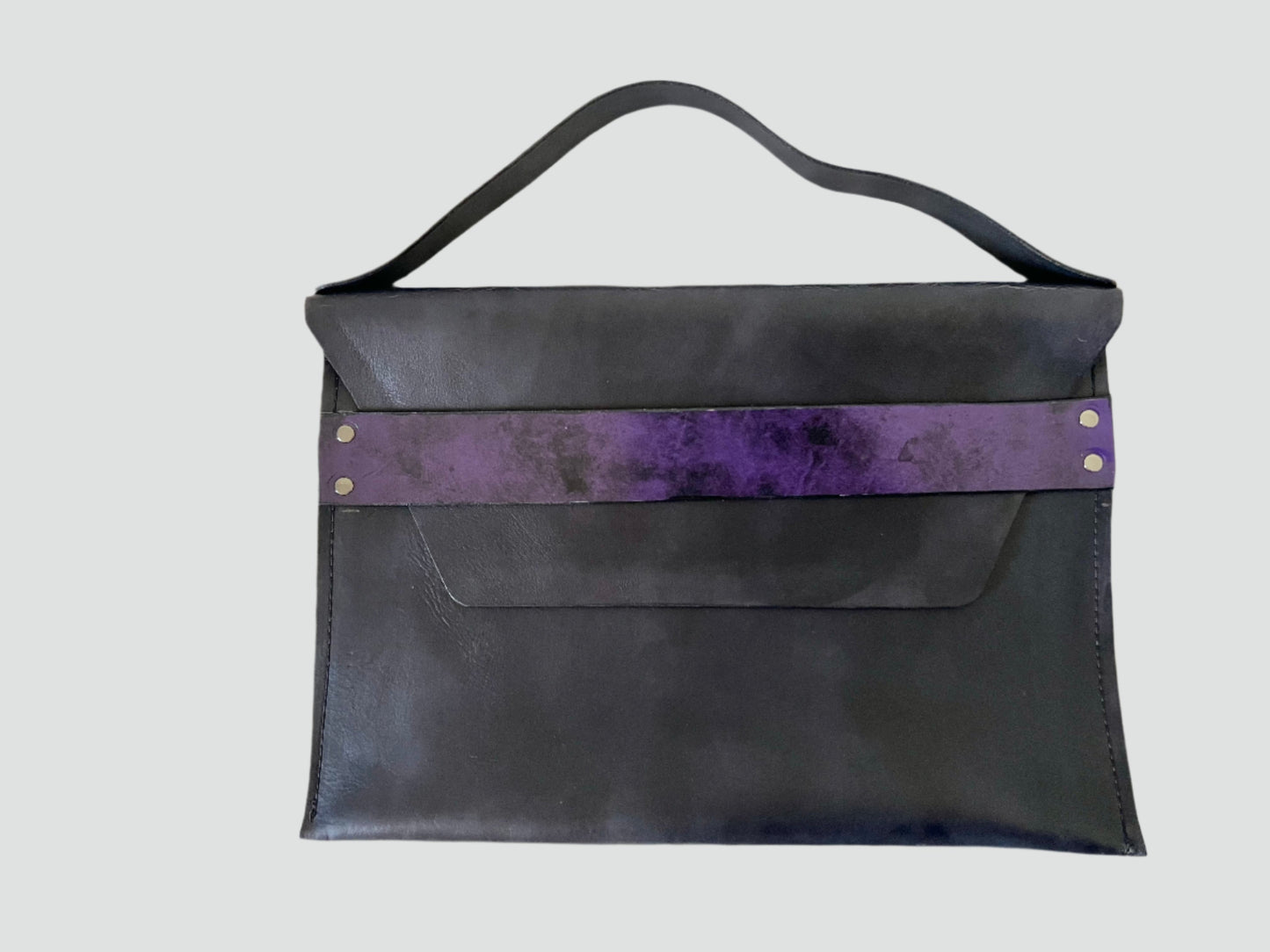 The 13 by 9 clutch is ideal for evening events or classy gatherings, combining practicality with a hint of boldness. It’s a statement piece that complements formal attire while adding a unique twist with the purple strap.