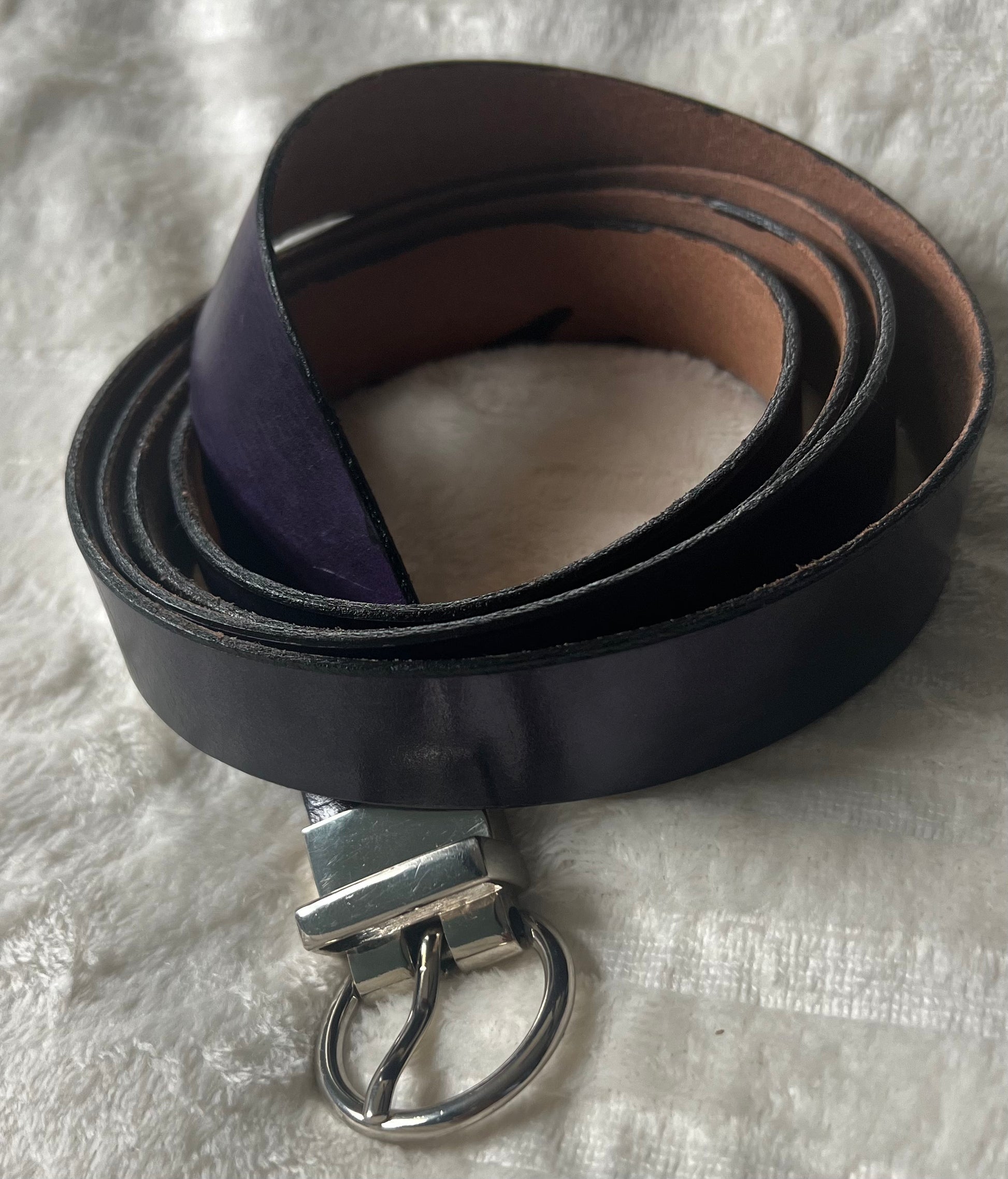 Deep purple belt with silver buckle.